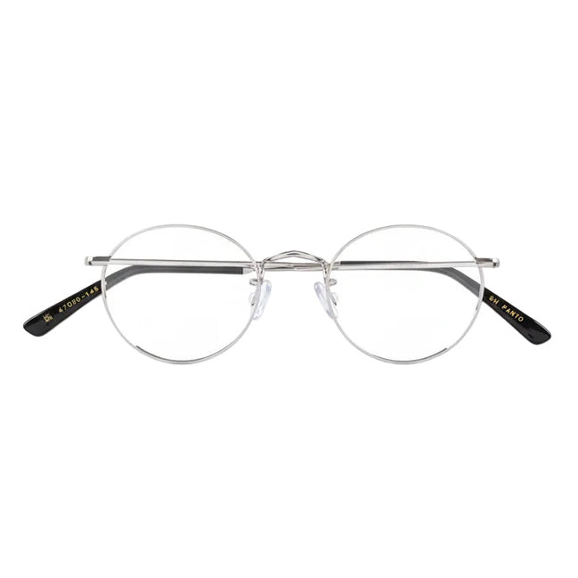 Round eyeglasses with black accents on a white background