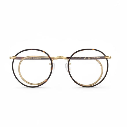 Round eyeglasses with gold frame on a white background