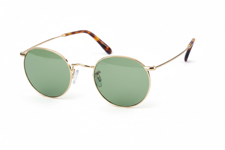 Round gold-framed glasses with tortoiseshell accents on a white background